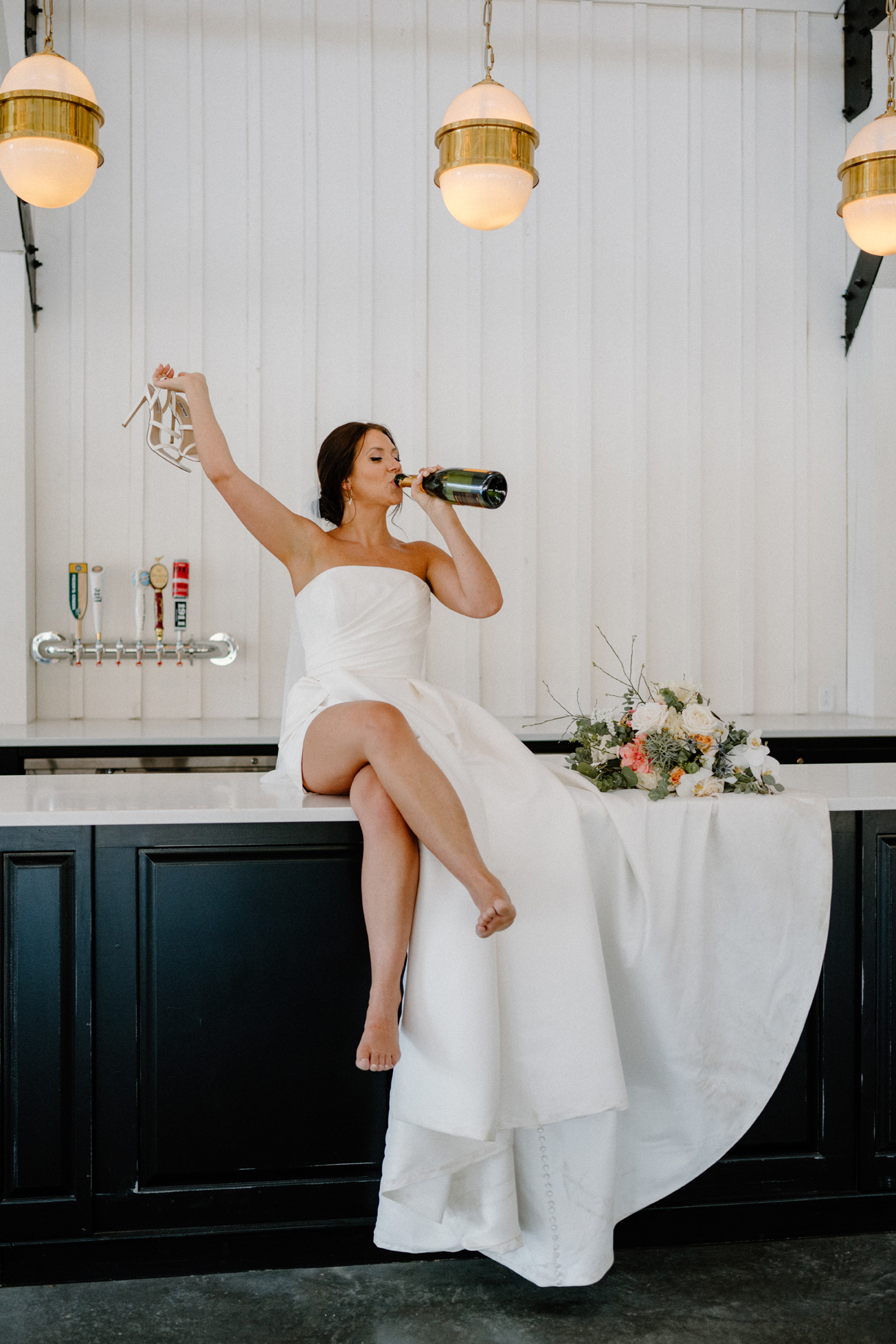 The bride takes a break at the bar