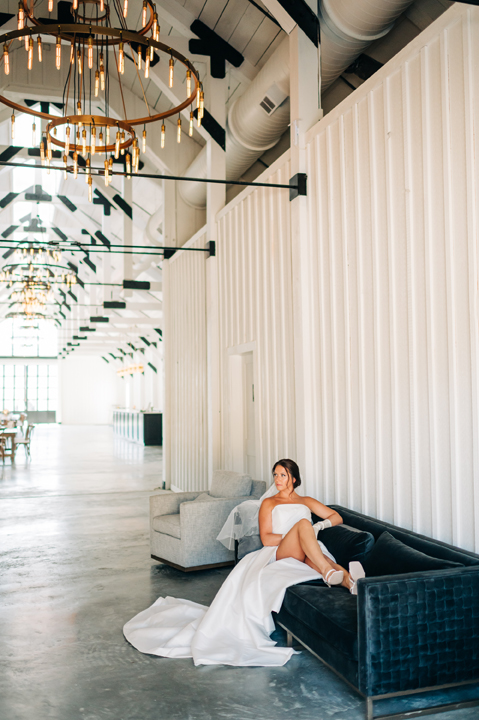 The bride takes a break on the couch